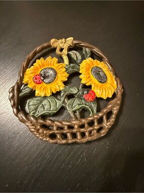 Cast iron sunflower and ladybug trivet